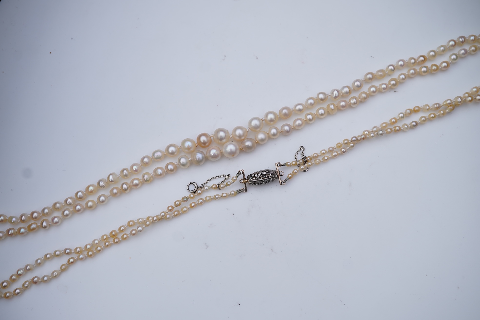 A natural pearl and diamond necklace, early 20th century